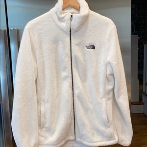 White fuzzy North Face jacket